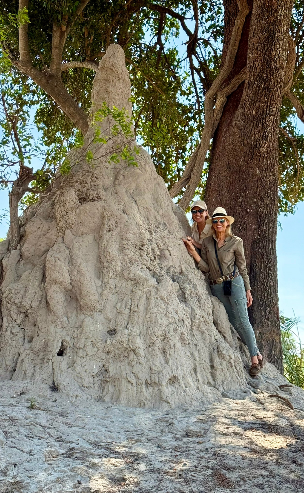 Albee & Hils next to a huge ants nest in Botswana